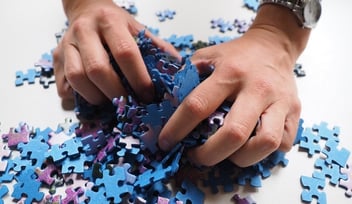 puzzle pieces and hands