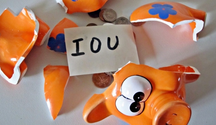 broken piggy bank with iou written on it